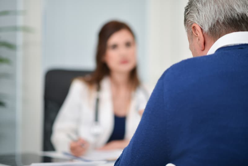 A male patient consulting with a doctor