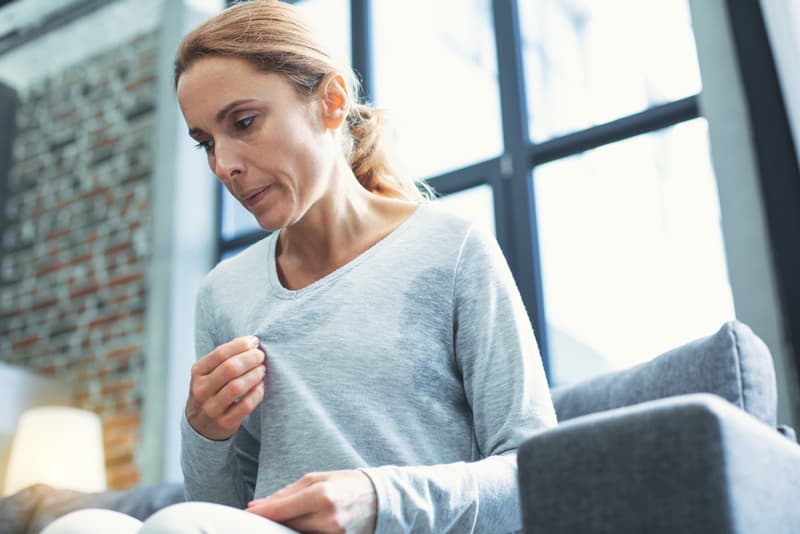 A lady experiencing sweating