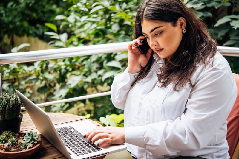 An overweight lady researching weight loss treatments