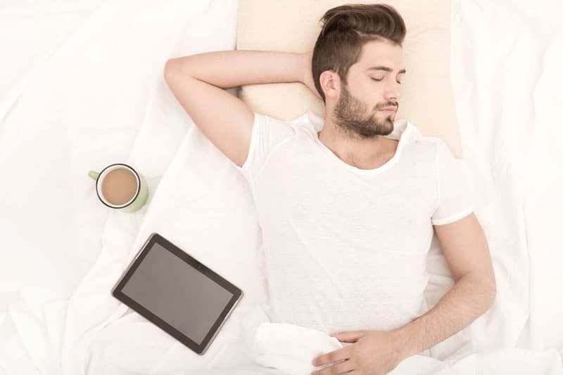 A man lying in bed sleeping