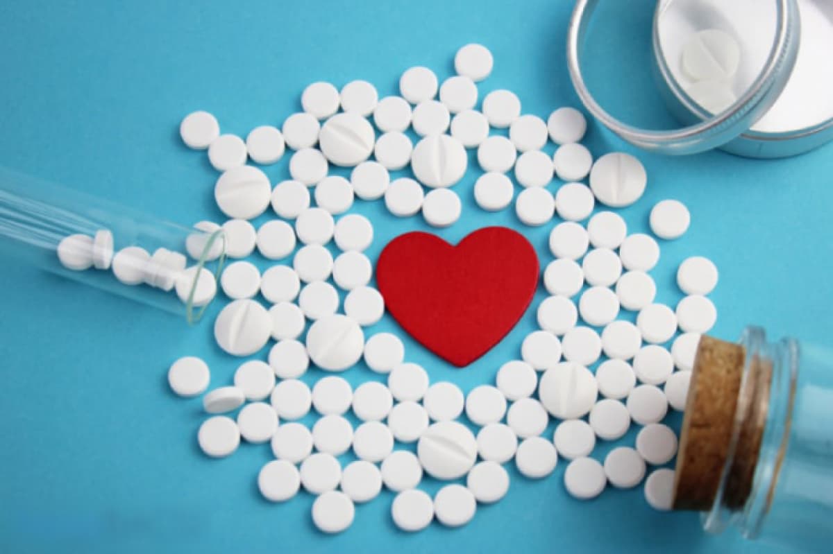 Propranolol tablets spread around a love heart