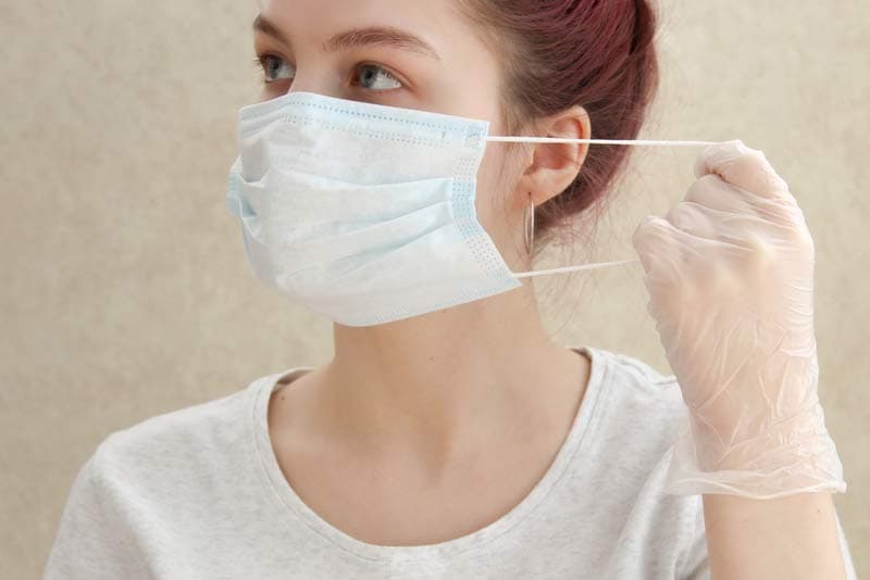 A lady wearing a face mask