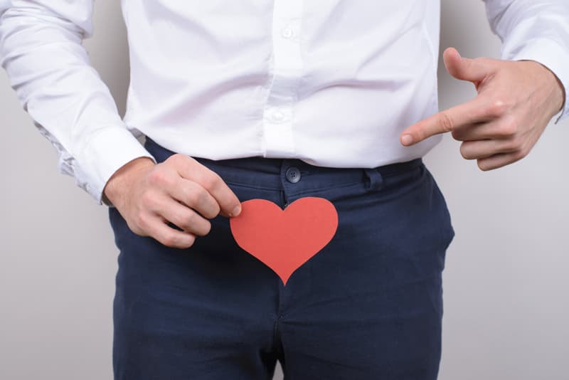 A man with a love heart placed over his crotch