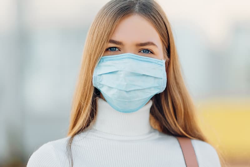 A lady wearing a mask