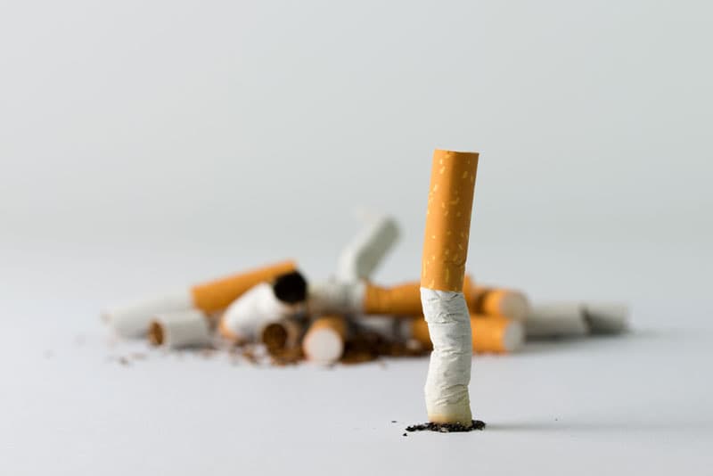 A cigarette squashed on the counter