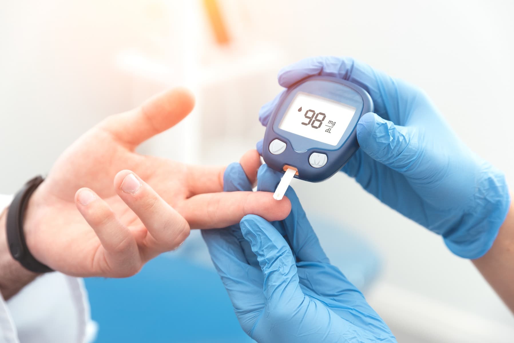 A finger prick blood test to check blood sugar levels