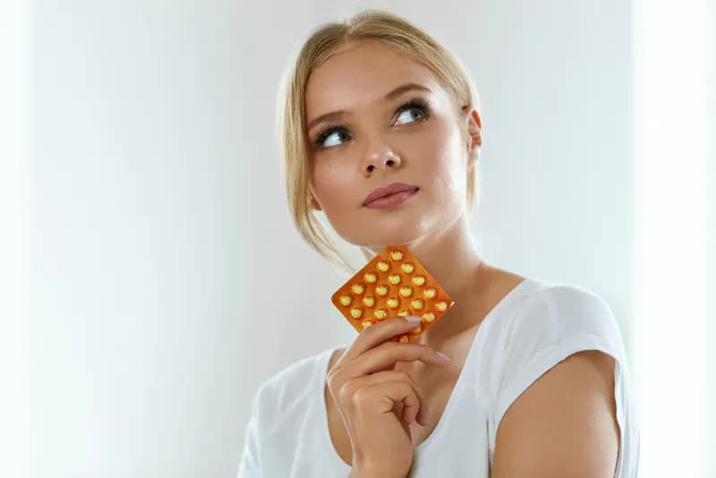 A lady with contraceptive pills