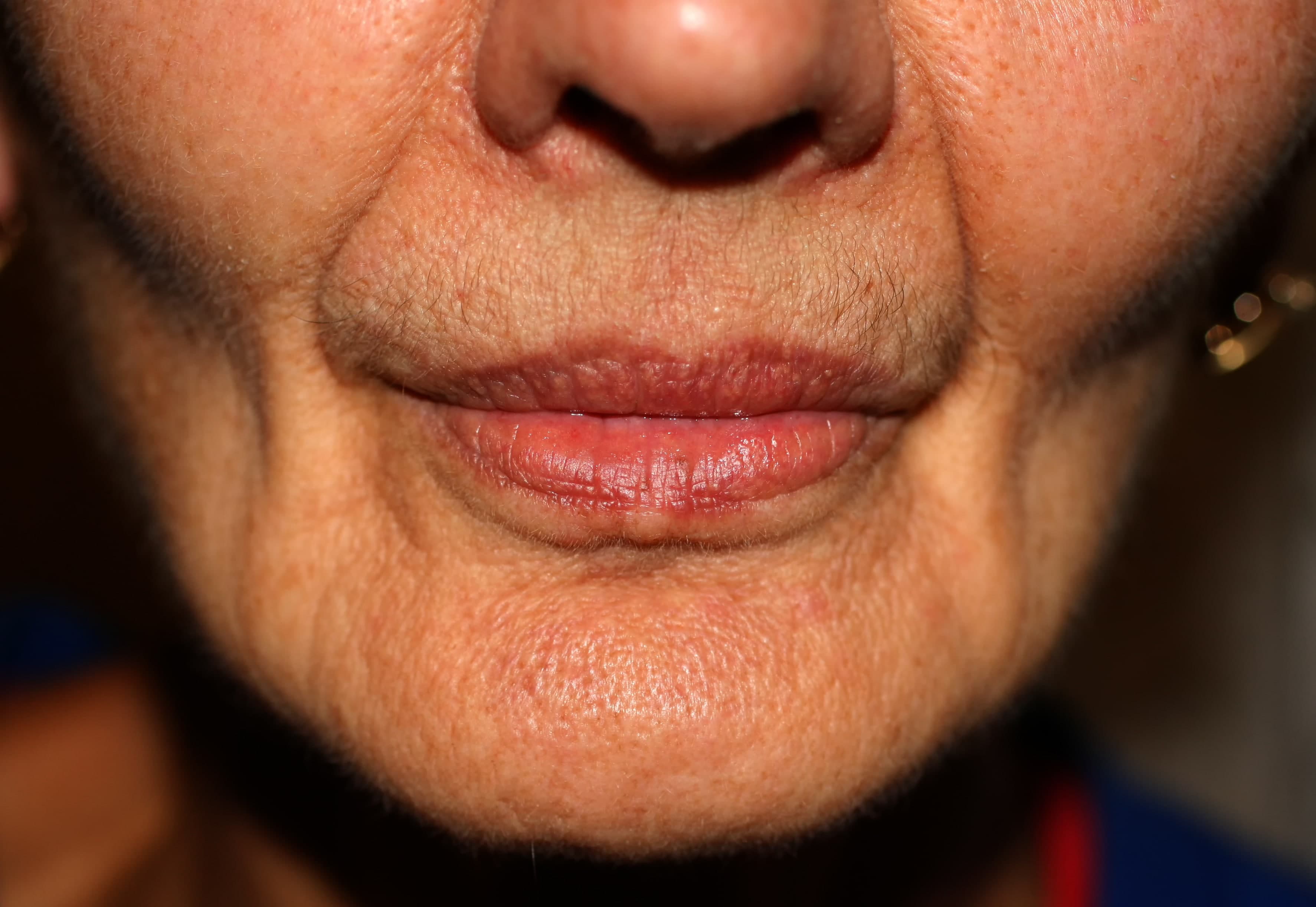 A close up of an elderly lady's face
