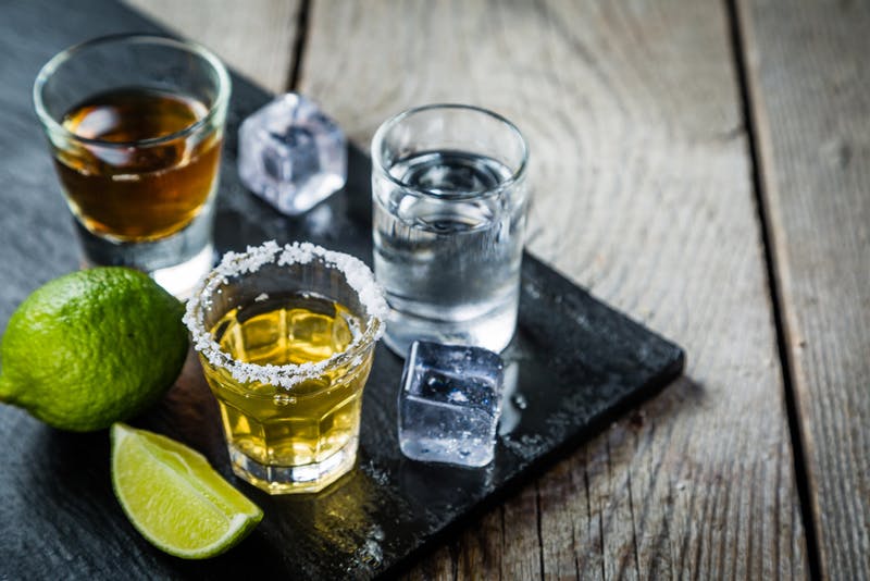 alcohol shots with a lime and ice