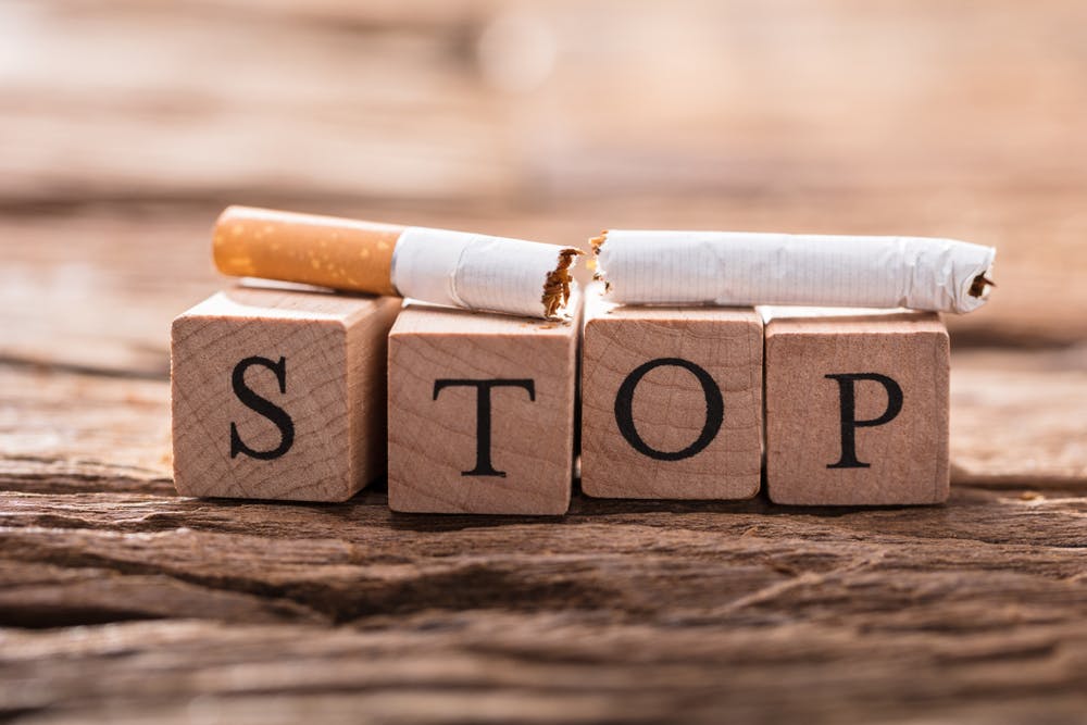 cigarette on the word stop