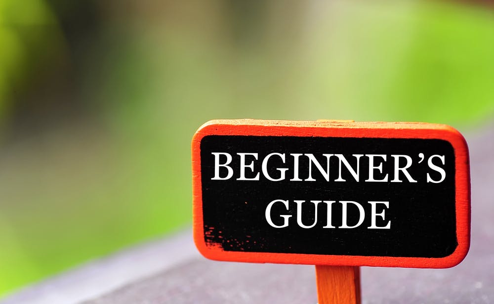 A sign that has the words 'beginners guide' on it