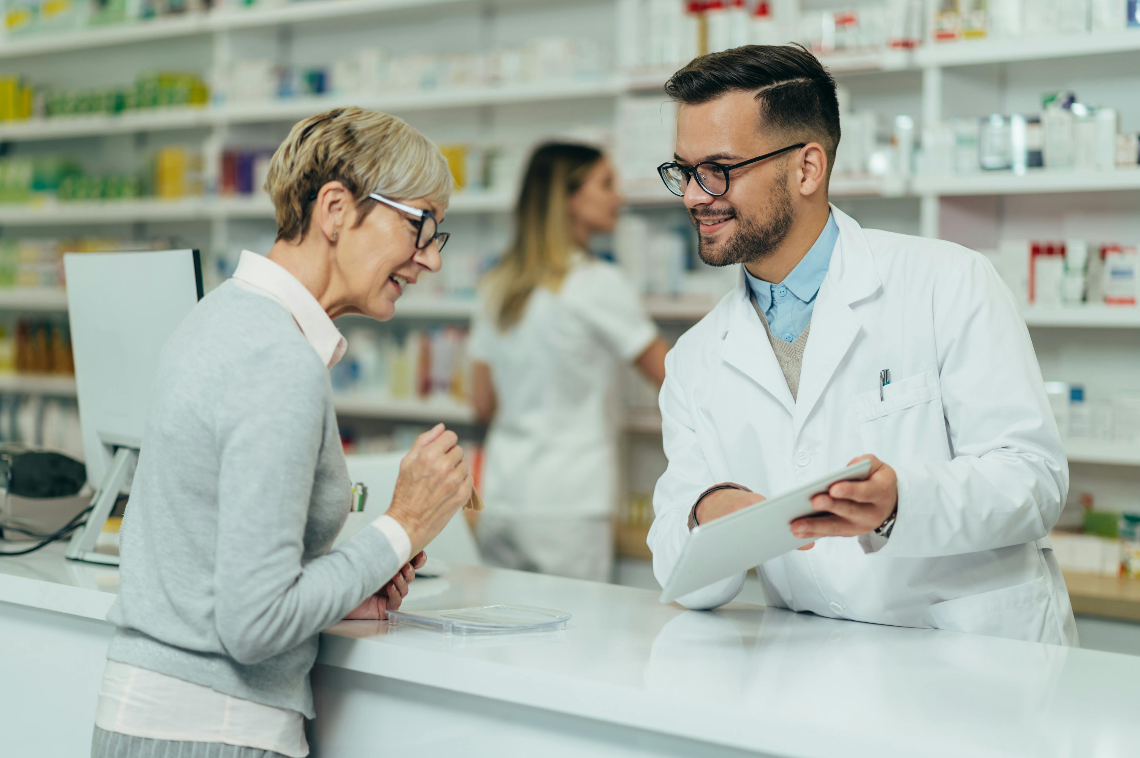 Lady consulting a pharmacist