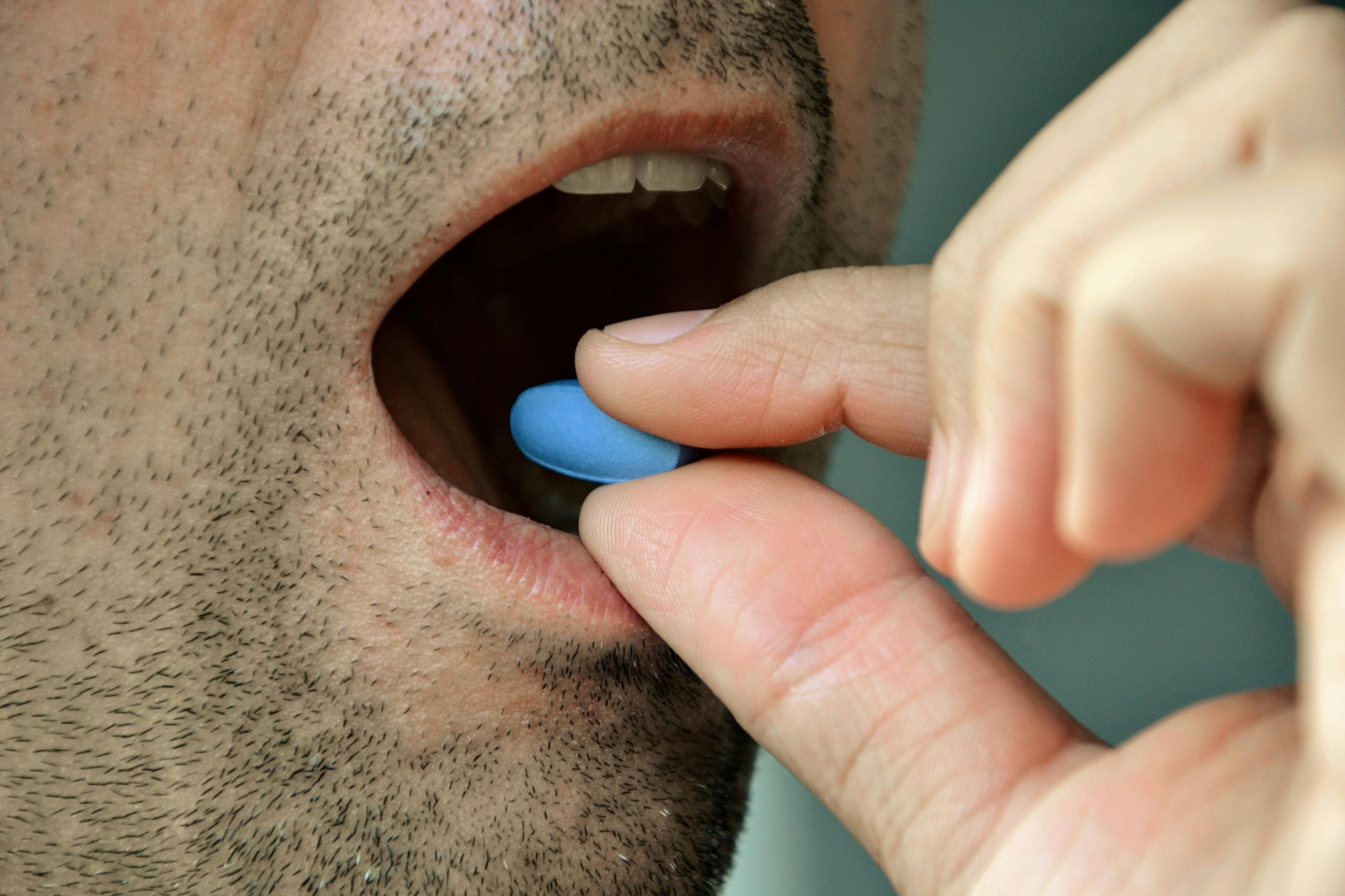 Mancunian Man taking the blue pill, Viagra