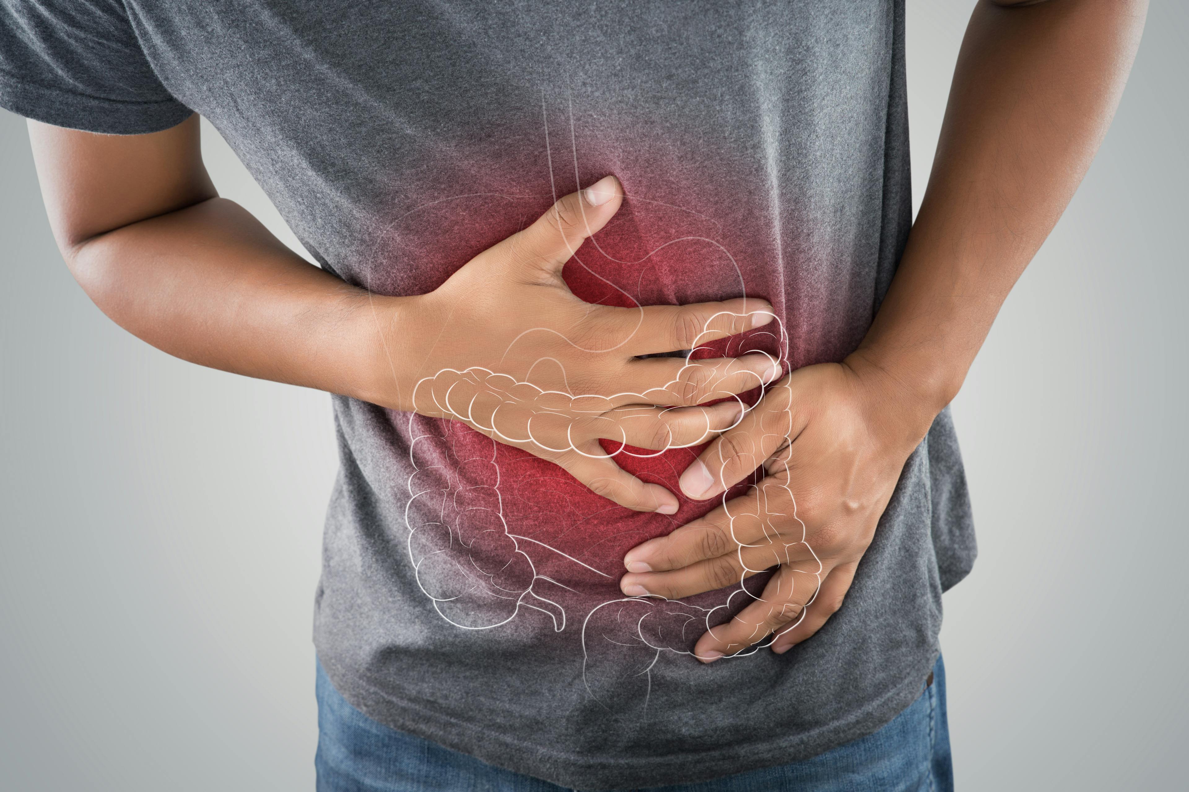 Man holding his stomach due to discomfort from IBS
